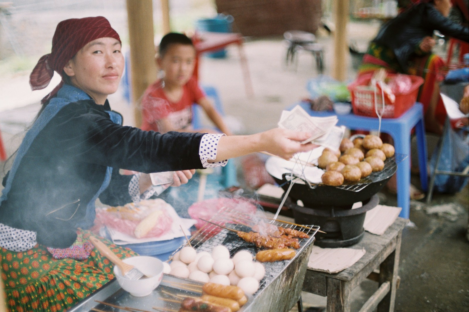 woman handing money to person